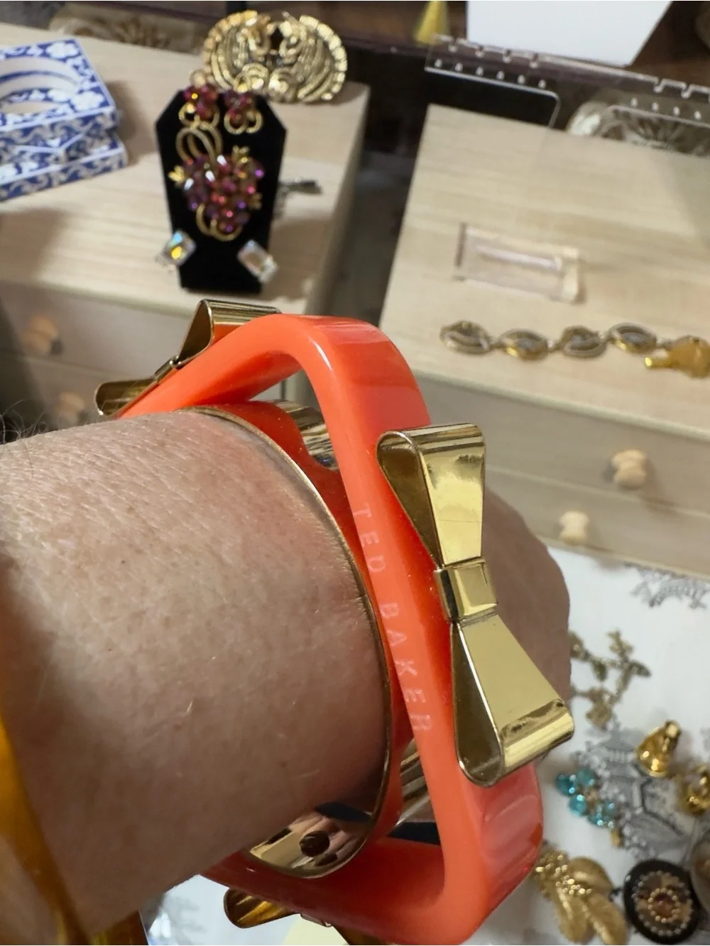 Ted Baker Coral Resin Bangle with Gold Bow Accents